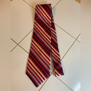 Bill Blass red tie with diagonal blue and white thin stripes.